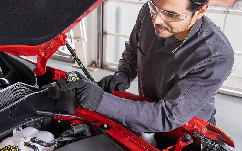 Service employee working on a car